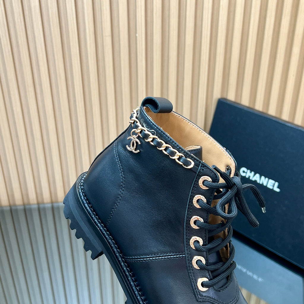 CHANEL 25S MARTIN LACE-UP BOOTS WITH CHAIN DETAIL IN BLACK CALFSKIN
