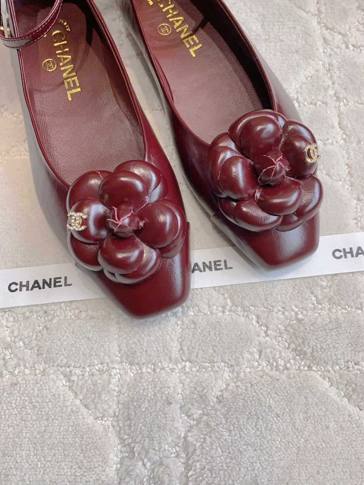 CHANEL 25S CAMELLIA SQUARE TOE FLATS IN ROSSO ANCORA CALFSKIN GOLD HARDWARE