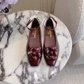 CHANEL 25S CAMELLIA SQUARE TOE FLATS IN ROSSO ANCORA CALFSKIN GOLD HARDWARE