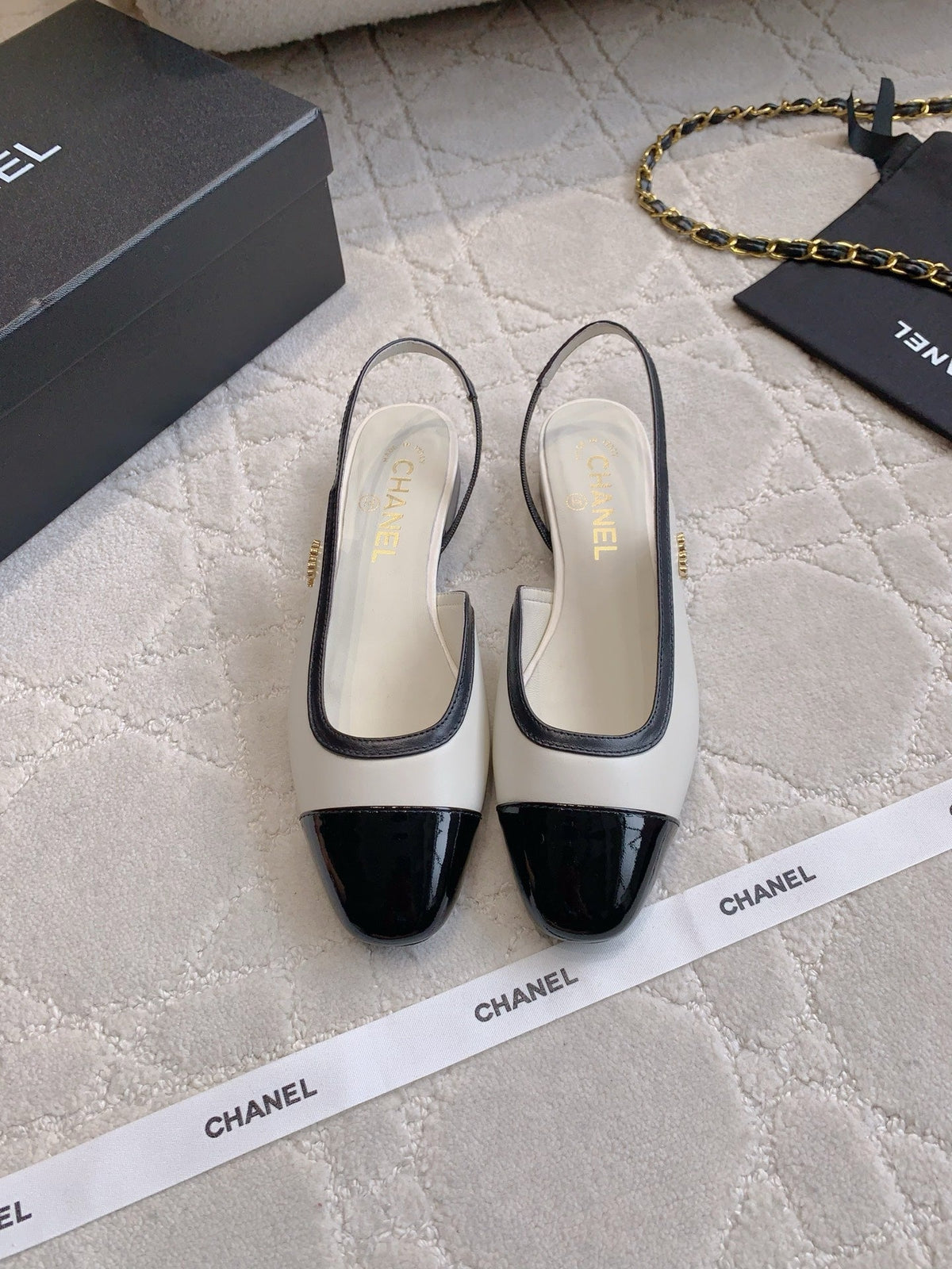 CHANEL 25S SLINGBACK IN BLACK AND WHITE CALFSKIN GOLD HARDWARE