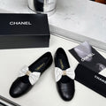 CHANEL 25S MARY JANES IN BLACK CALFSKIN WITH WHITE BOW GOLD HARDWARE
